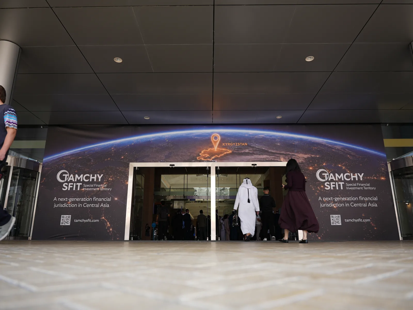 The AIM Congress venue in Dubai: the entrance dressed in Tamchy SFIT branding and the atmosphere of the event